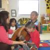 Wendy teaching guitar class to pre-schoolers